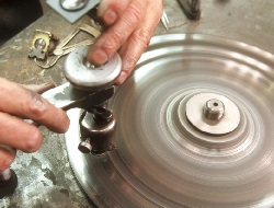 repairing damaged diamonds on a polishing wheel